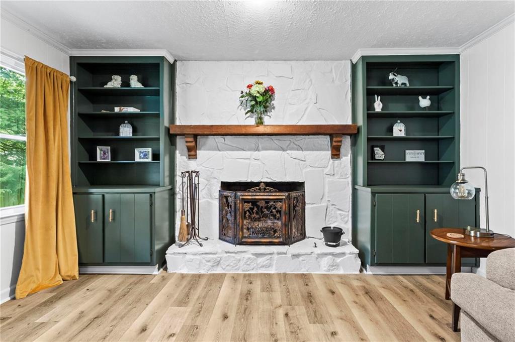 6971 Recreation Lane Acworth, GA 30102 - Photo 6 of 23 a living room with furniture and a fireplace