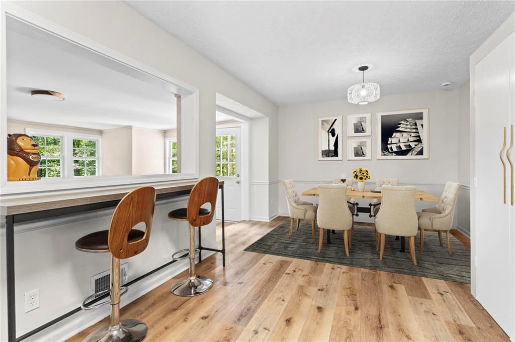 6971 Recreation Lane Acworth, GA 30102 - Photo 10 of 23 a view of a dining room with furniture and wooden floor