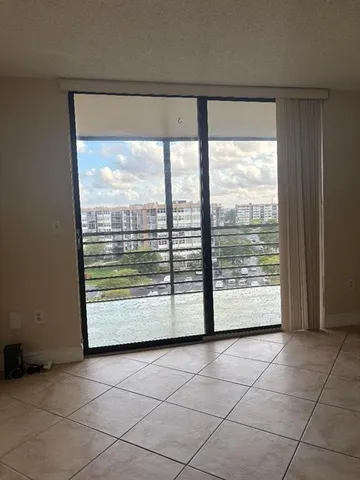 a view of an empty room with a large window