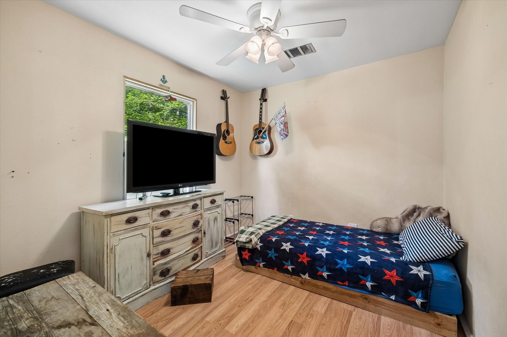 438 Havard Road, Unit 2 Huffman, TX 77336 - Photo 9 of 10 a bedroom with furniture and flat screen tv