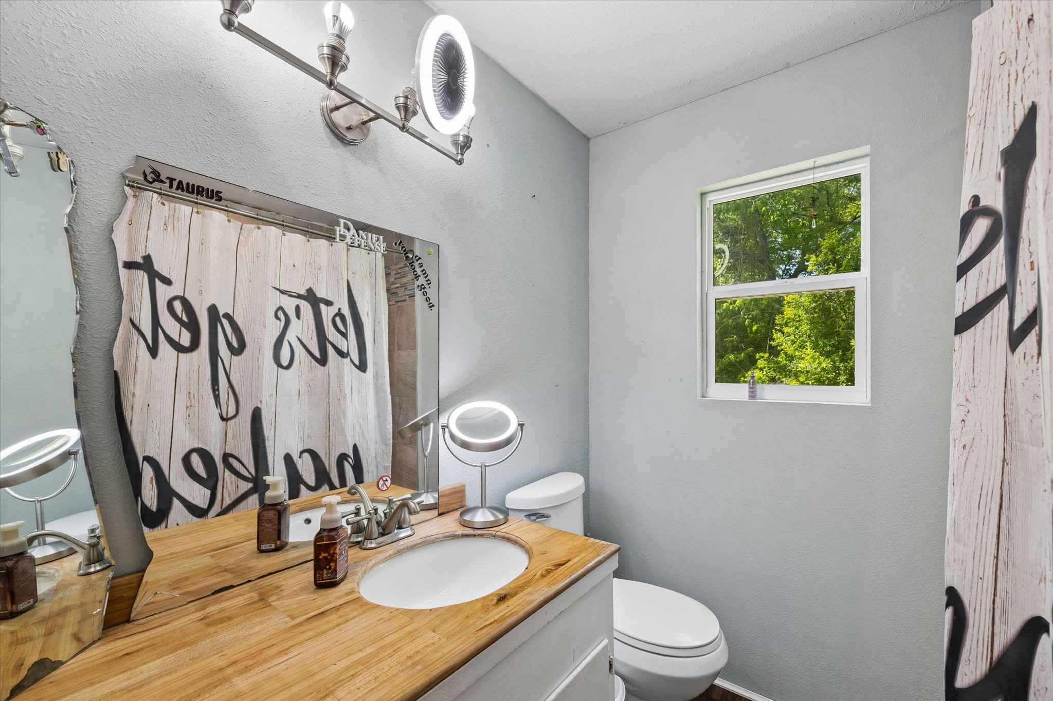 438 Havard Road, Unit 2 Huffman, TX 77336 - Photo 10 of 10 a bathroom with a sink a mirror and a toilet