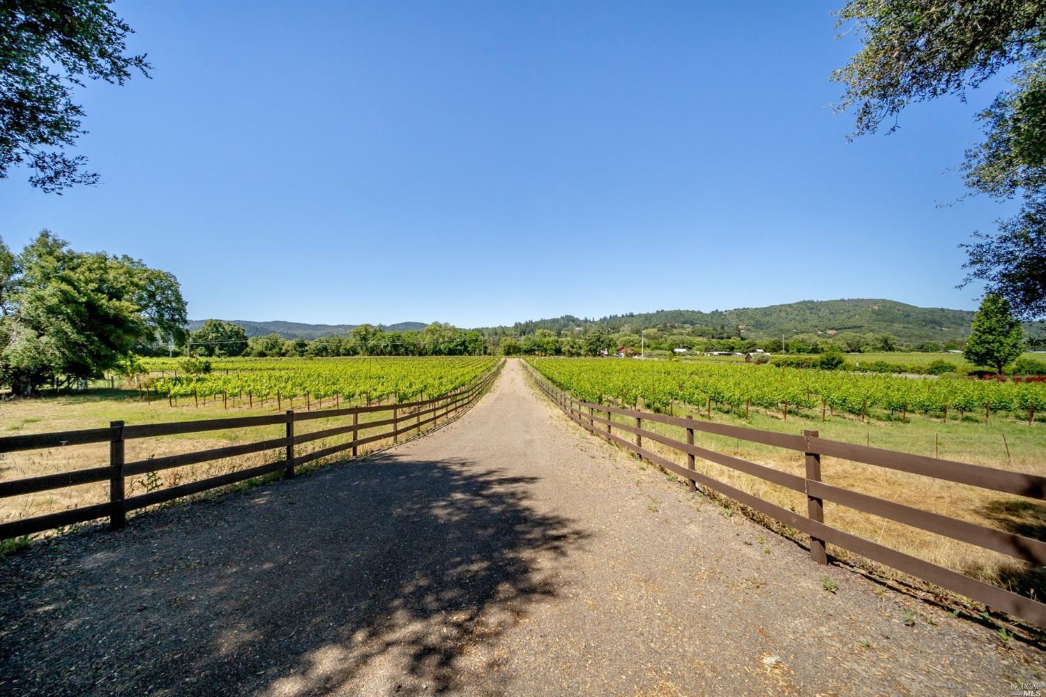 a view of a road with an outdoor seating