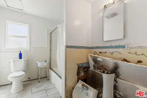 a bathroom with a sink and a toilet