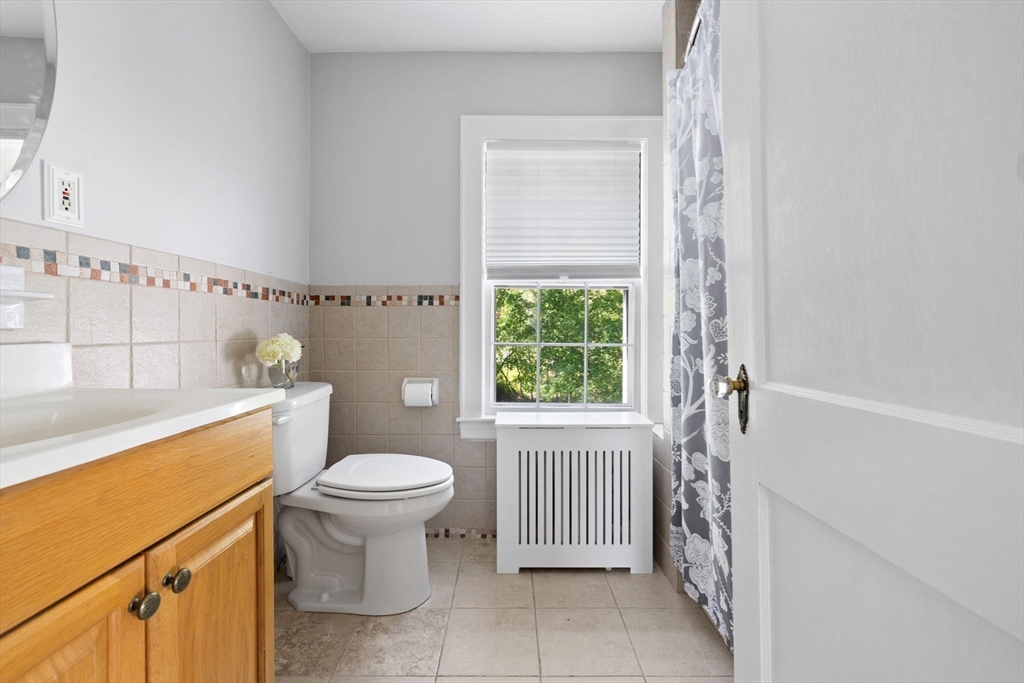 80 Baxter Street Melrose, MA 02176 - Photo 14 of 23 a bathroom with a sink toilet and tub