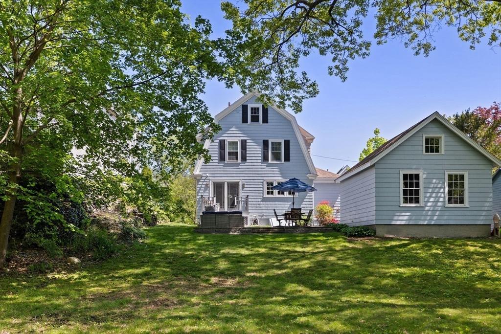 80 Baxter Street Melrose, MA 02176 - Photo 18 of 23 a front view of a house with a garden