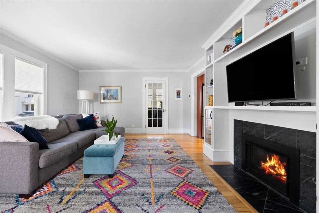 80 Baxter Street Melrose, MA 02176 - Photo 4 of 23 a living room with furniture and a fireplace or television