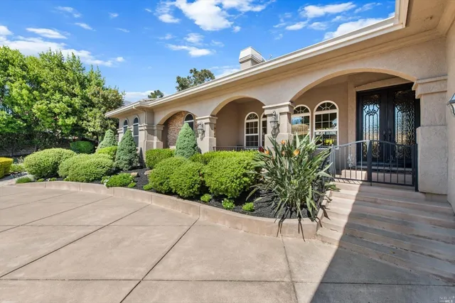 a living room with furniture a fireplace and wooden floor