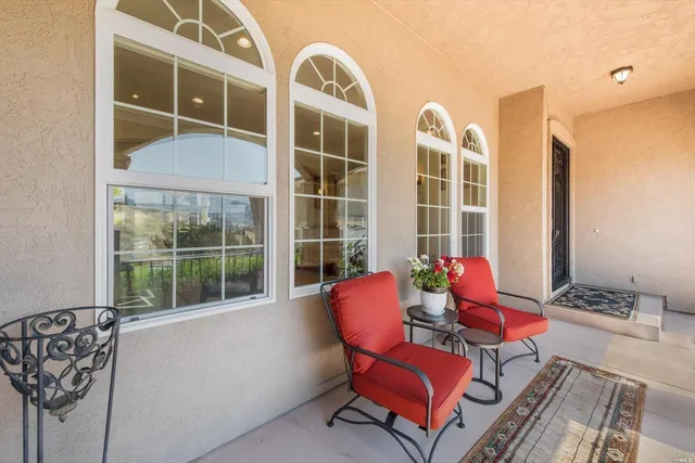 a living room with furniture fireplace and window