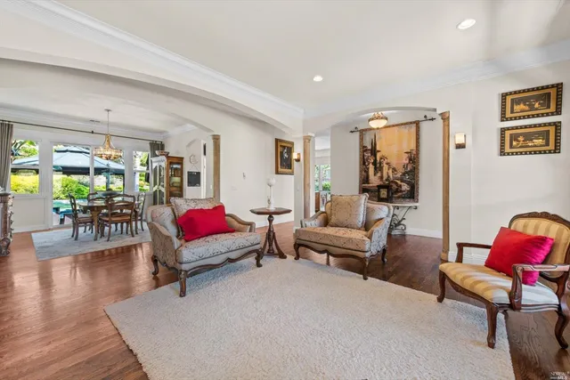 a kitchen with stainless steel appliances granite countertop a sink a window and a counter space