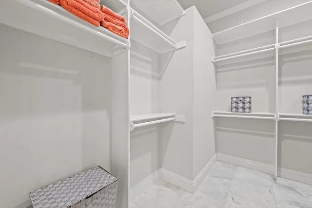 a view of a terrace with furniture and city view