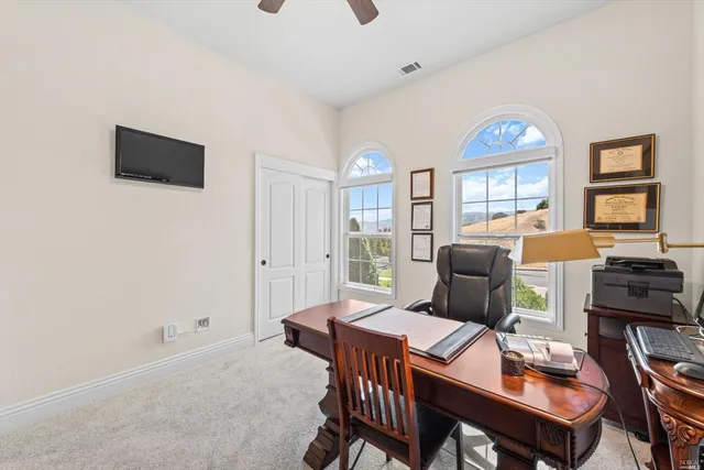 a view of a street with a tree in the background