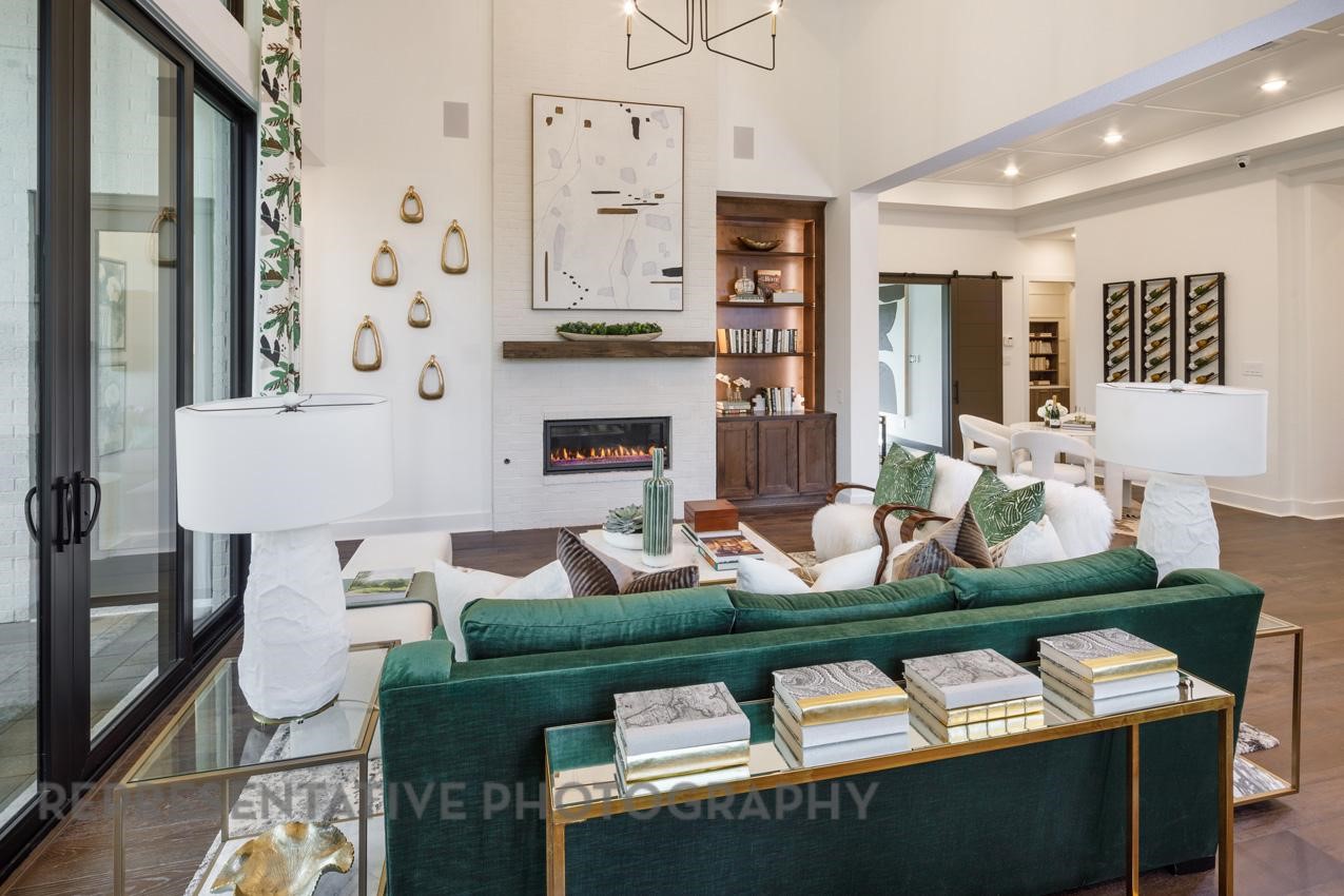 5402 Verona Ridge Drive Fulshear, TX 77406 - Photo 12 of 49 a view of a dining room with furniture a fireplace and wooden floor
