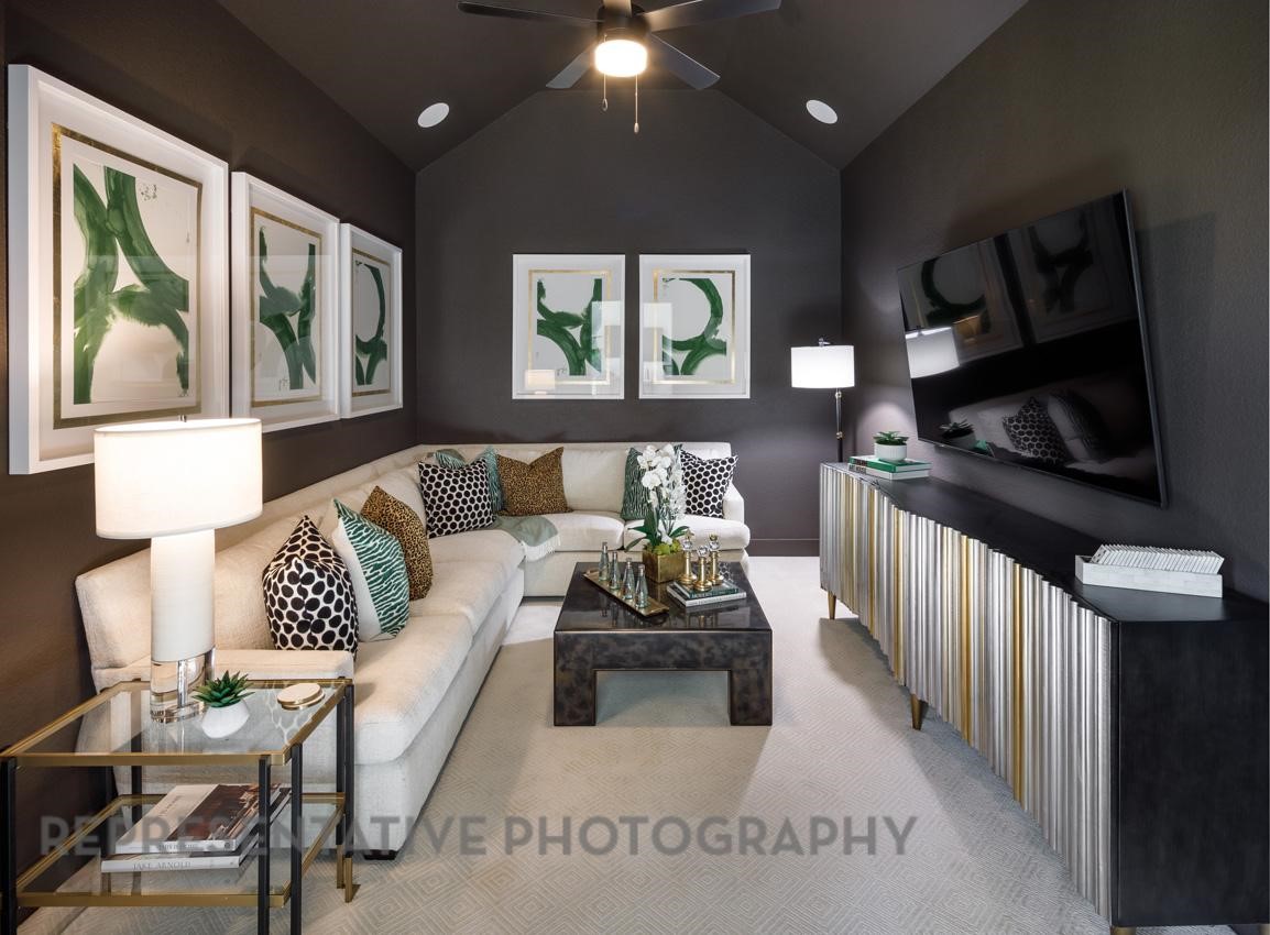 5402 Verona Ridge Drive Fulshear, TX 77406 - Photo 42 of 49 a living room with furniture and a flat screen tv