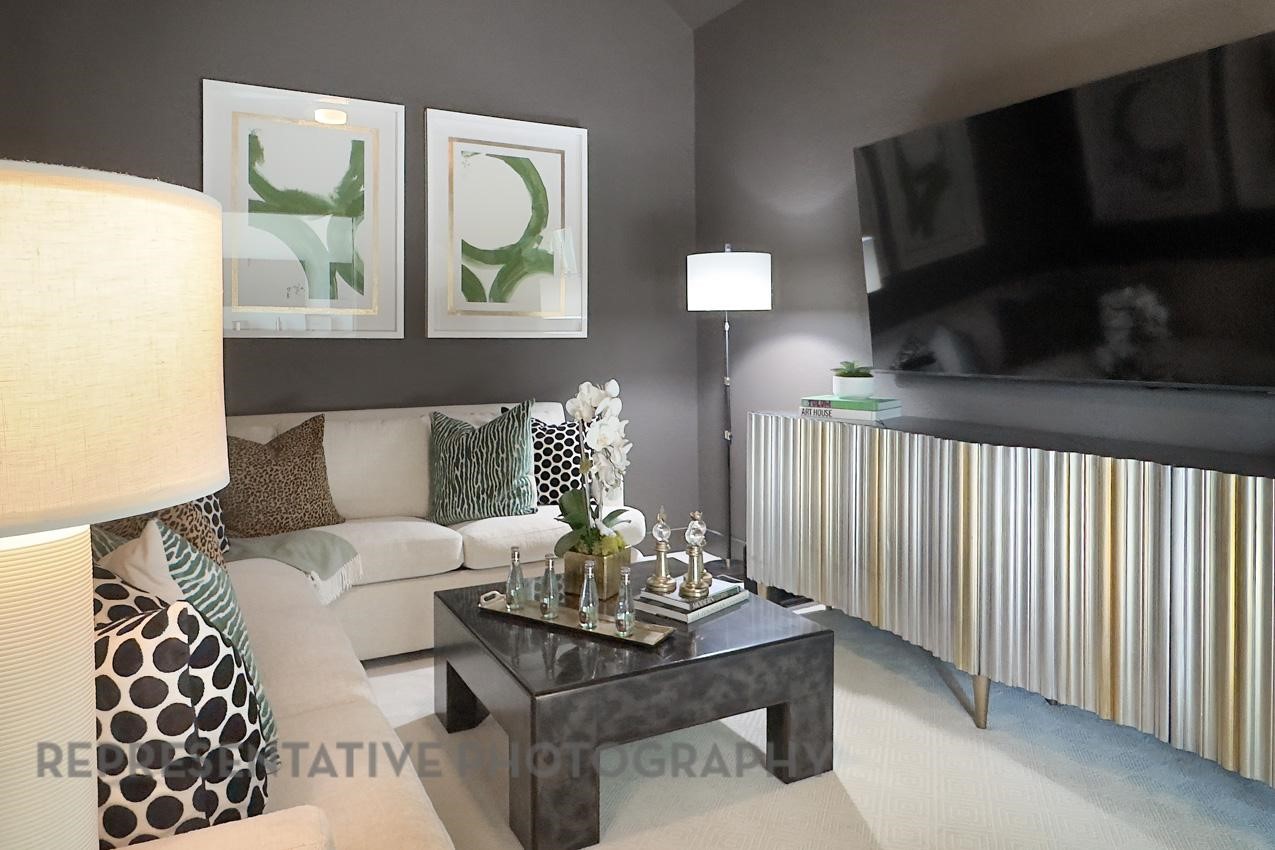 5402 Verona Ridge Drive Fulshear, TX 77406 - Photo 43 of 49 a living room with furniture and a fireplace