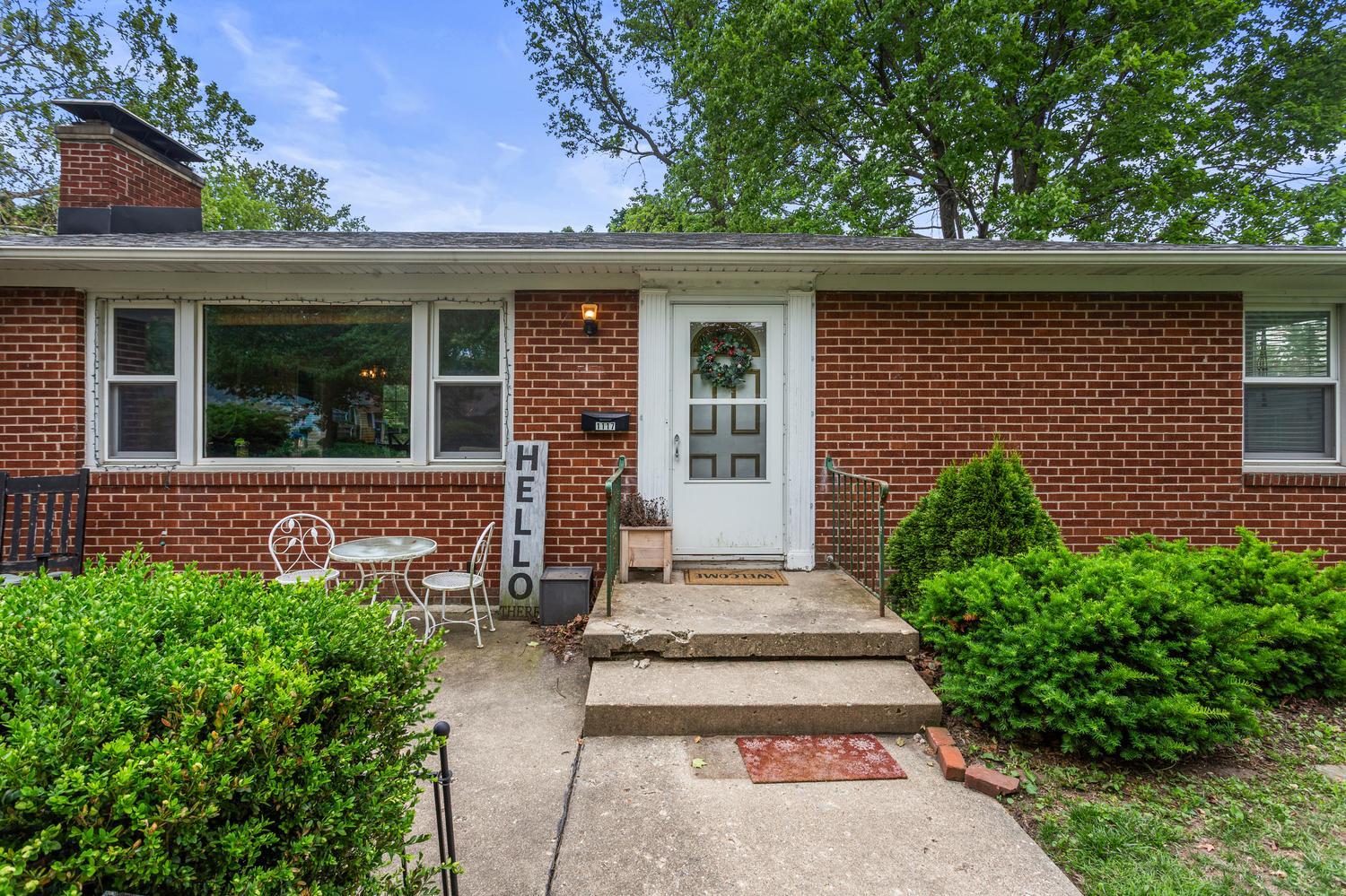 1117 West Union Street Champaign, IL 61821 - Photo 3 of 29 front view of a house with a bench