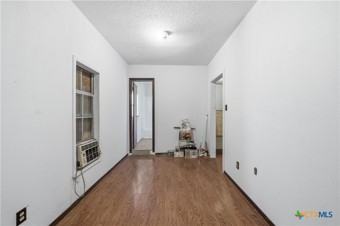 1780 Moores Mill Road Temple, TX 76504 - Photo 9 of 17 a view of a hallway with wooden floor and closet