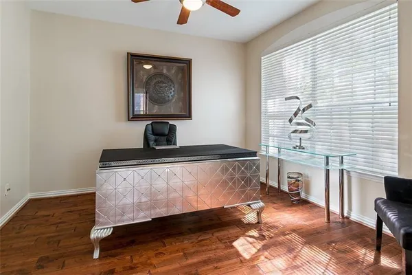a living room with a bed furniture and a window