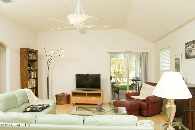 1772 Keswick Road St. Augustine, FL 32084 - Photo 6 of 25 a living room with furniture and a flat screen tv