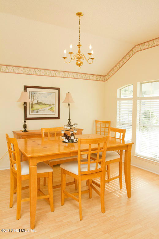 1772 Keswick Road St. Augustine, FL 32084 - Photo 8 of 25 a dining room with a table and chairs