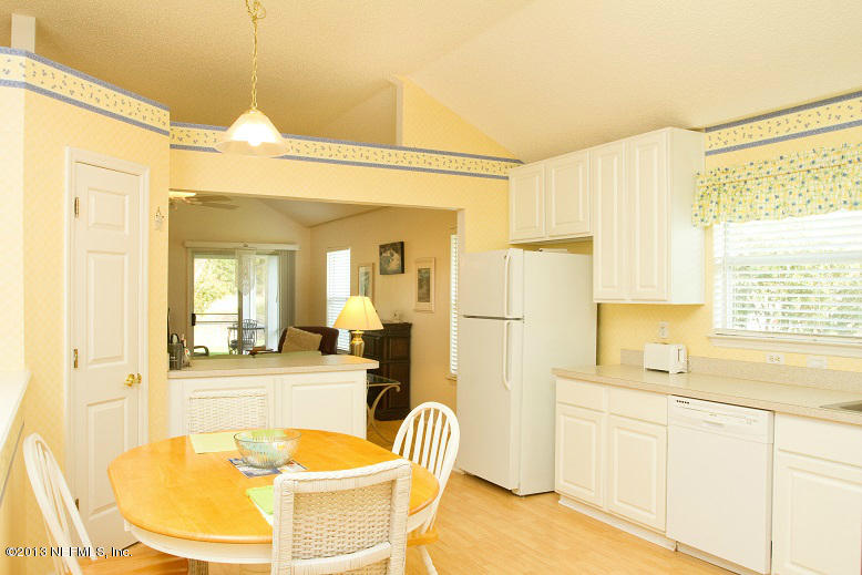 1772 Keswick Road St. Augustine, FL 32084 - Photo 10 of 25 a large white kitchen with a large window