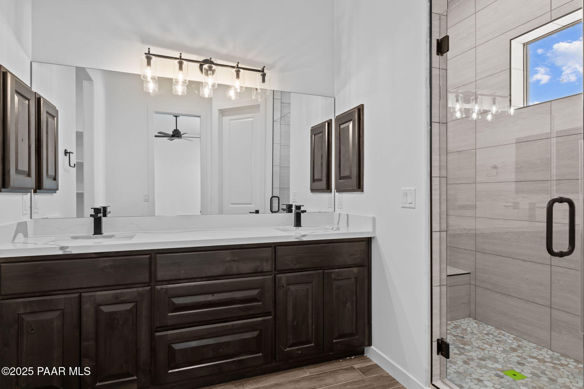 21032 West Skinner Road Wittmann, AZ 85361 - Photo 23 of 34 a bathroom with a double vanity sink mirror and double