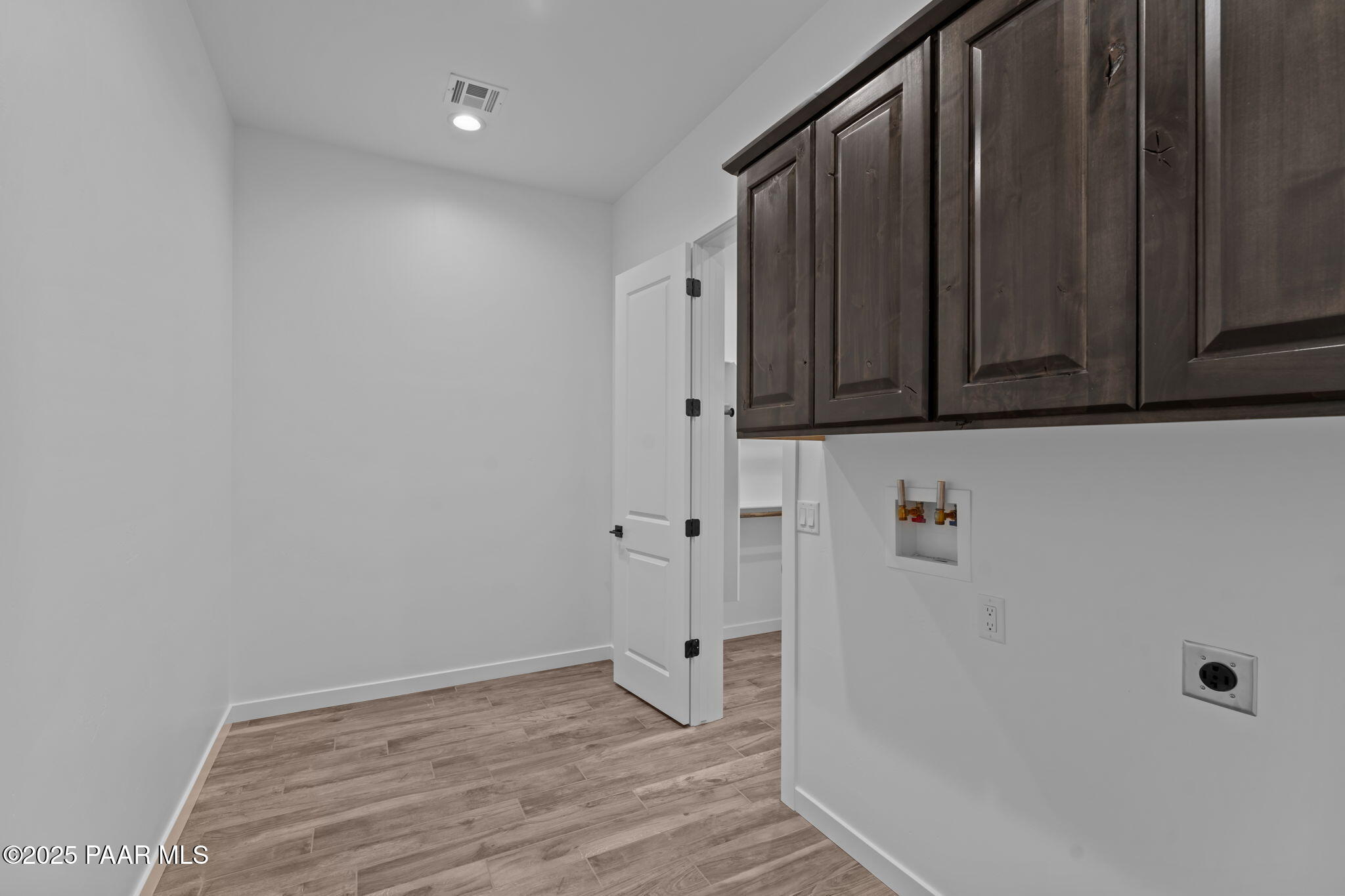 21032 West Skinner Road Wittmann, AZ 85361 - Photo 29 of 34 a view of a hallway with wooden floor