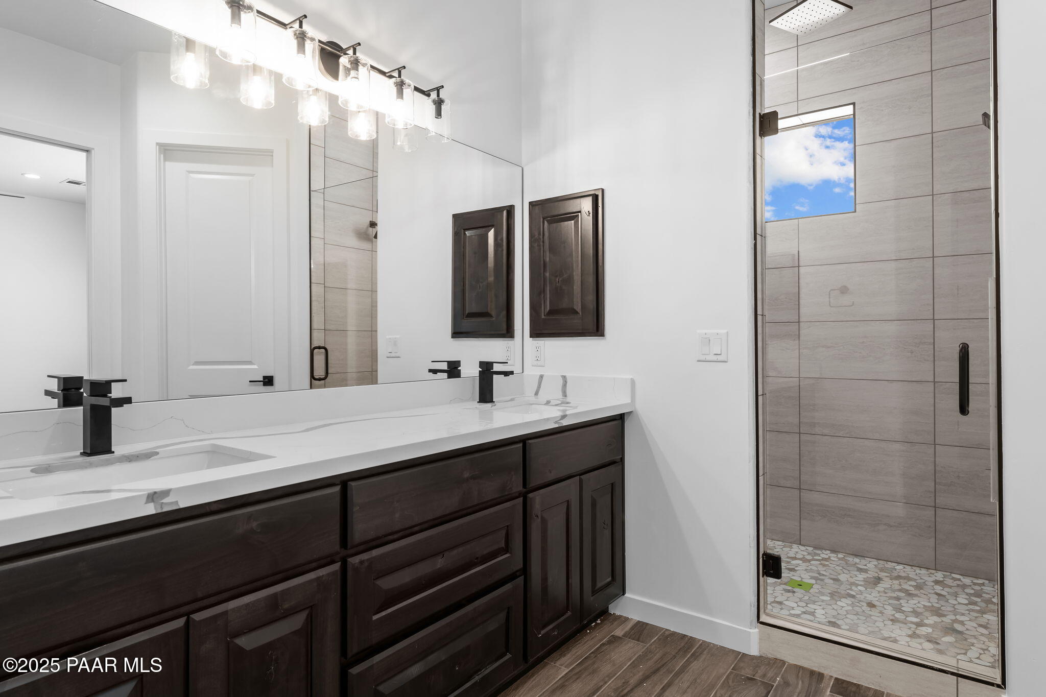 21032 West Skinner Road Wittmann, AZ 85361 - Photo 4 of 34 a bathroom with a double vanity sink mirror and shower