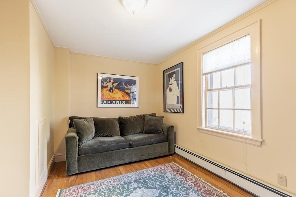 64 Wachusett Road Needham, MA 02492 - Photo 12 of 25 a living room with furniture and a window