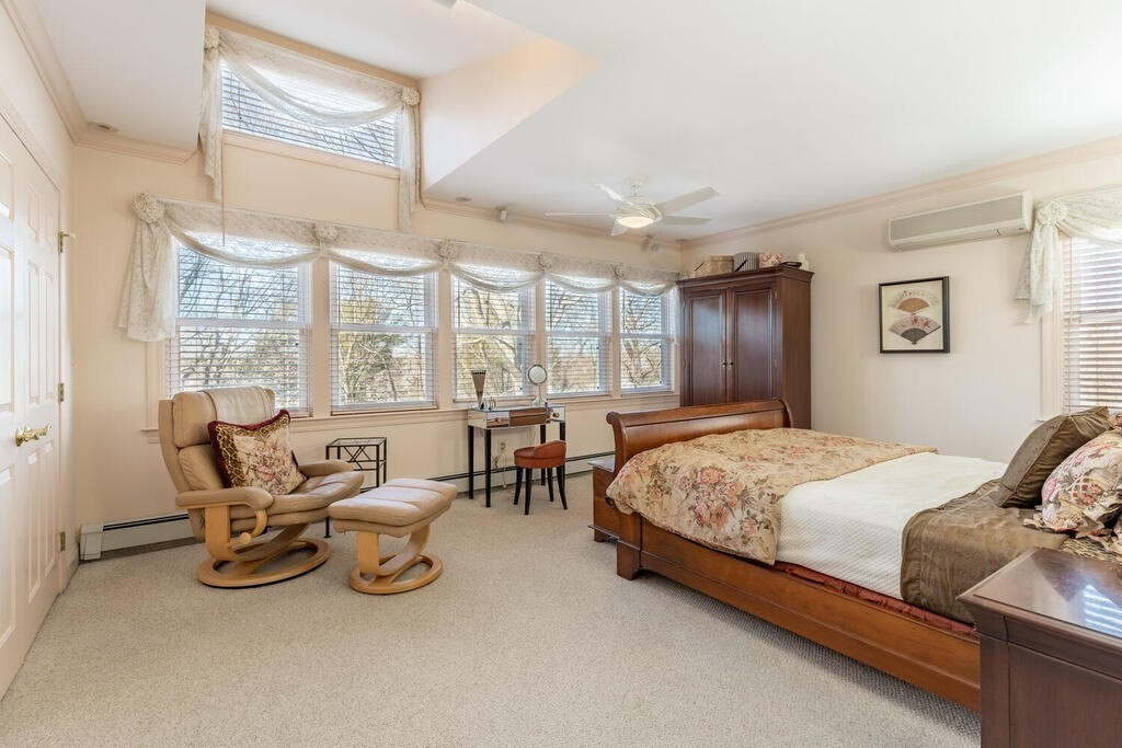 64 Wachusett Road Needham, MA 02492 - Photo 15 of 25 a bedroom with bed and large windows