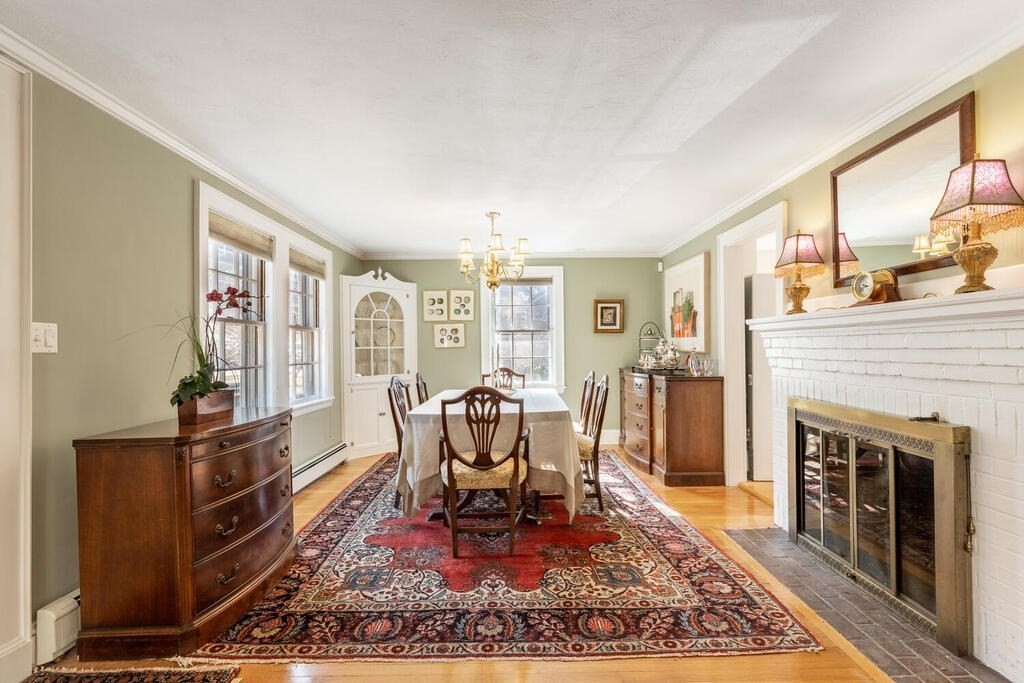 64 Wachusett Road Needham, MA 02492 - Photo 6 of 25 a living room with furniture rug and a fireplace