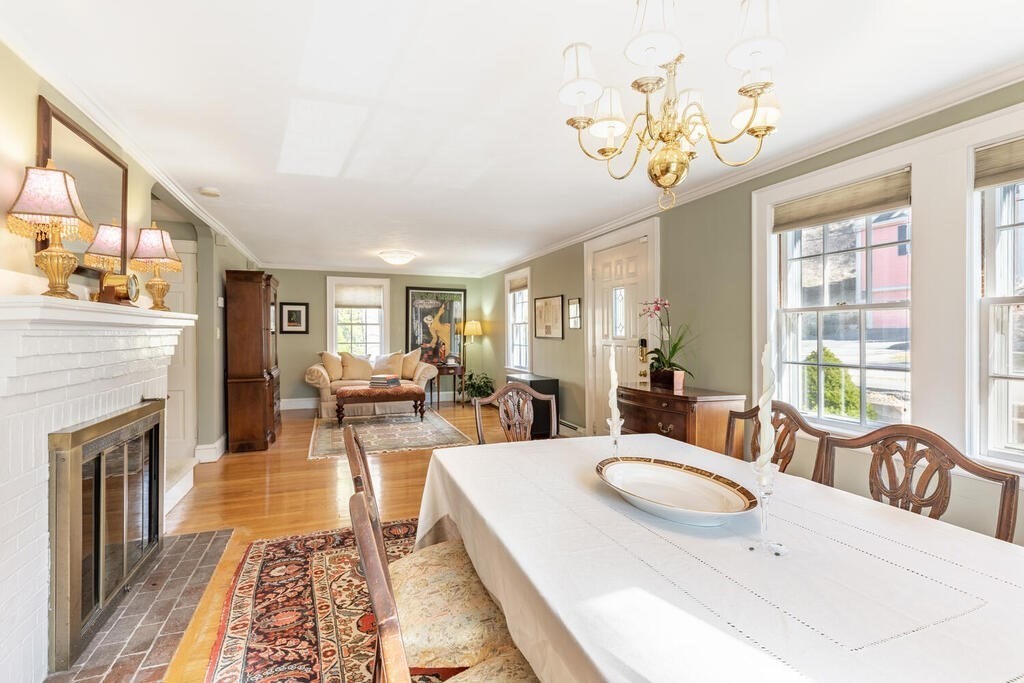 64 Wachusett Road Needham, MA 02492 - Photo 7 of 25 a living room with fireplace furniture and a chandelier