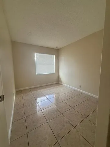 en empty room with windows