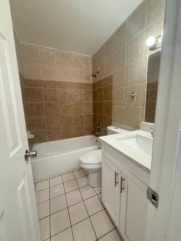a bathroom with a toilet and a bathtub