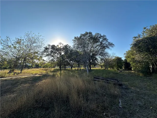 a view of a lake with a yard