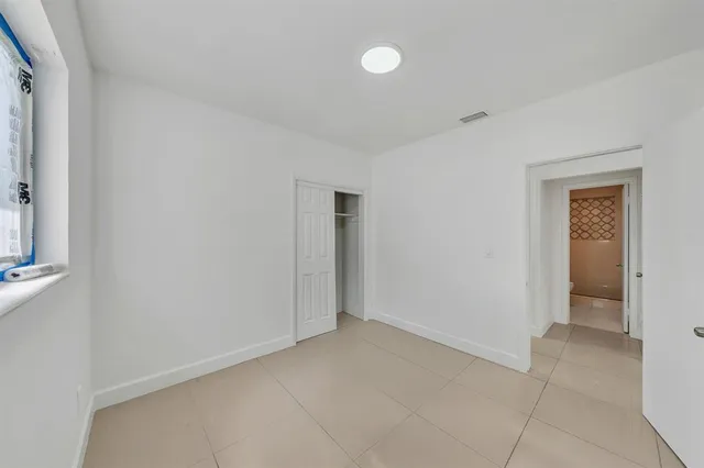 a bathroom with a sink a toilet and shower curtain