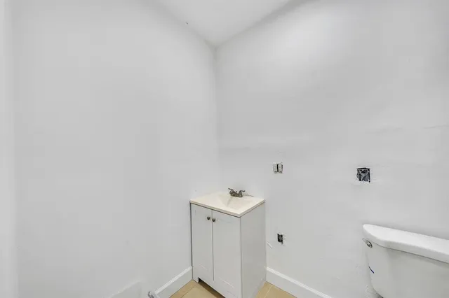 a bedroom with furniture and a bed