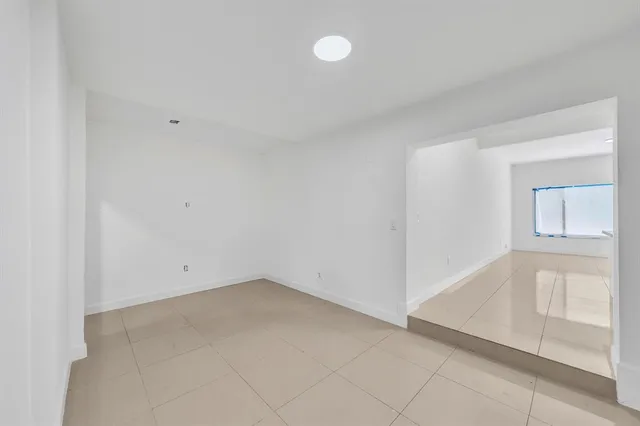 a kitchen with a sink and a refrigerator