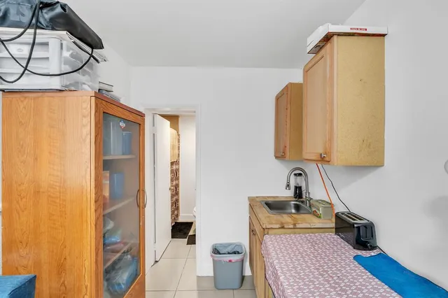 a bedroom with bed and a window