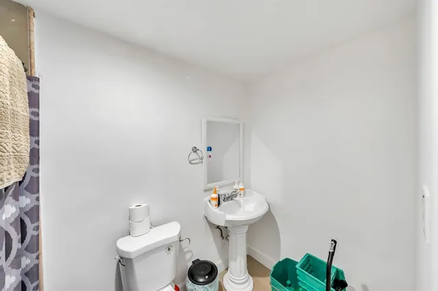 a bathroom with a sink toilet and vanity