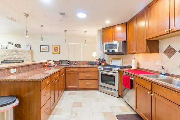 a view of a storage & utility room with a washer dryer