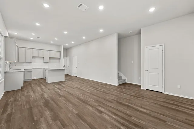 a view of kitchen with wooden floor