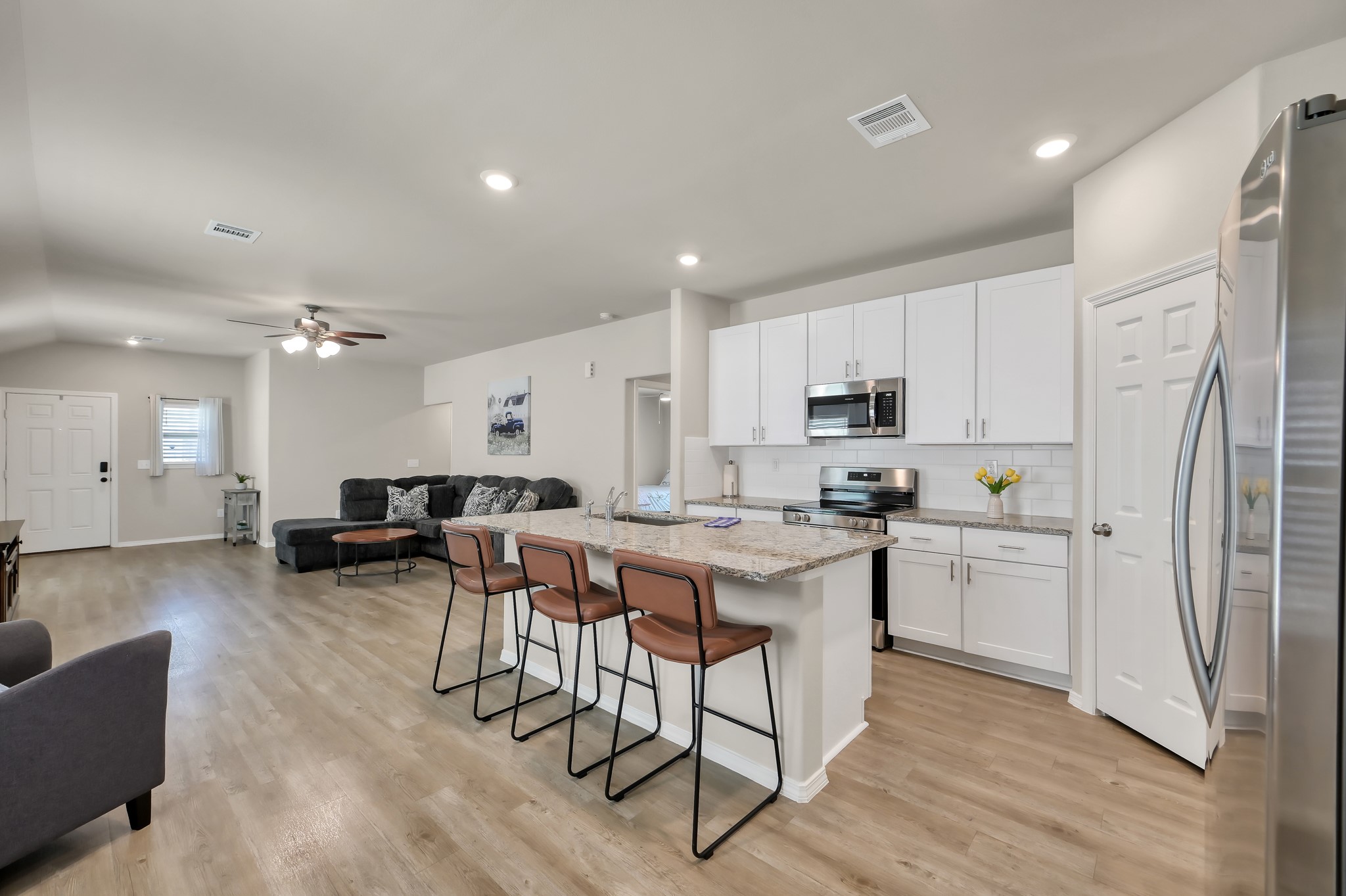 514 Dalloway Street Conroe, TX 77316 - Photo 9 of 27 Living and kitchen combination ideal for entertaining