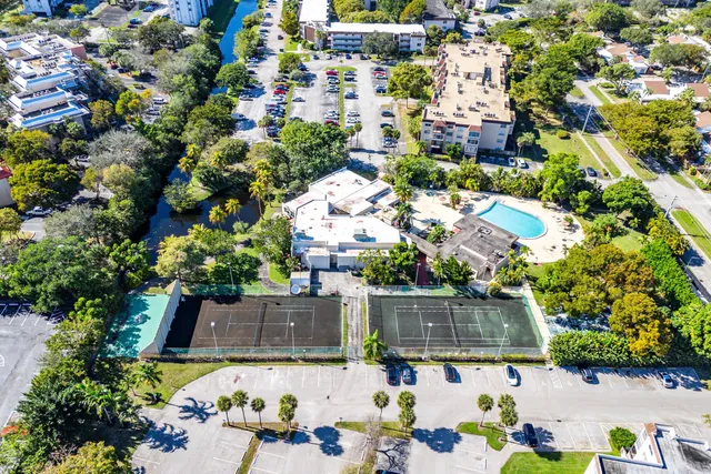 an aerial view of a house with yard