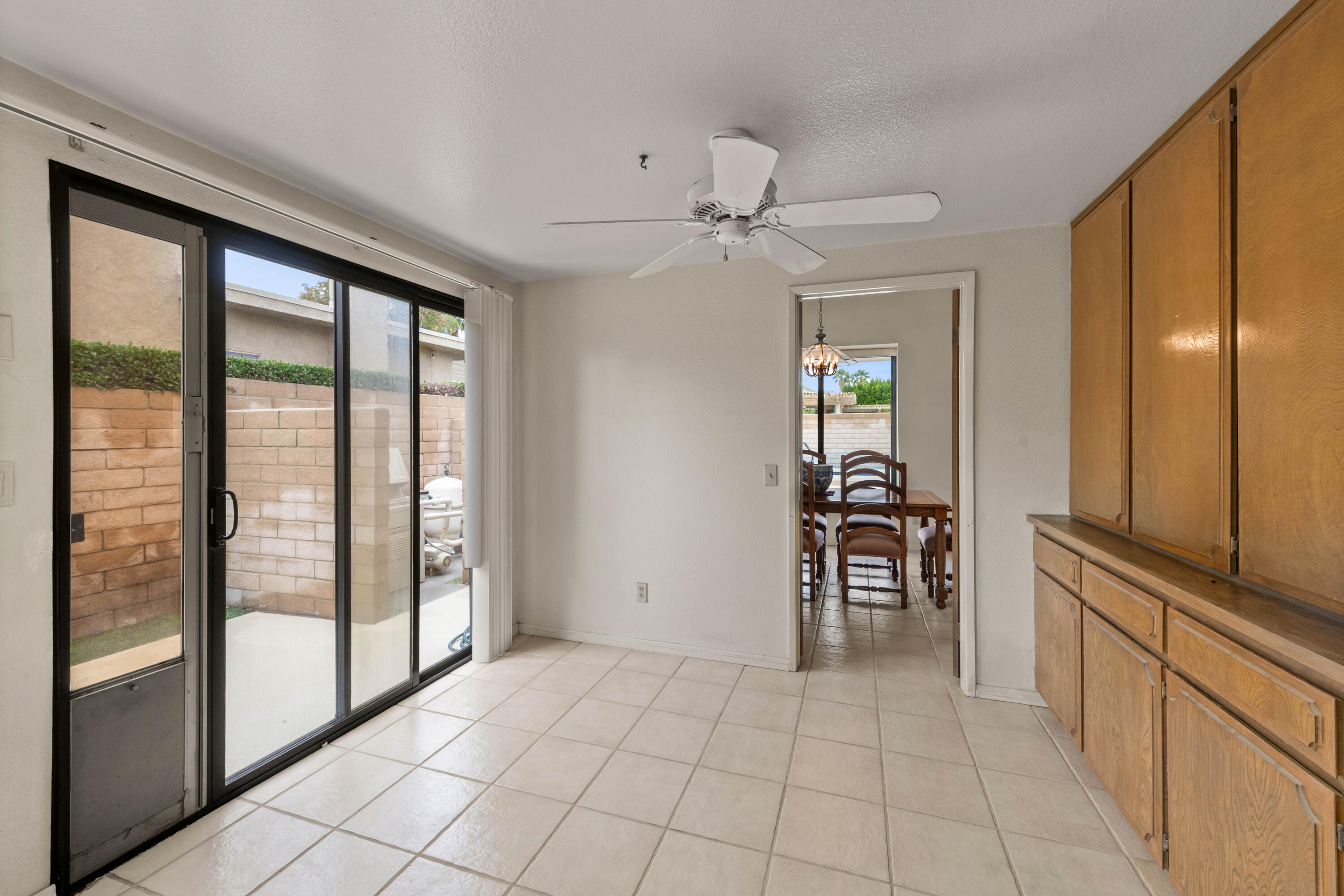 53 San Simeon Place Rancho Mirage, CA 92270 - Photo 12 of 30 a view of a hallway with furniture and chandelier