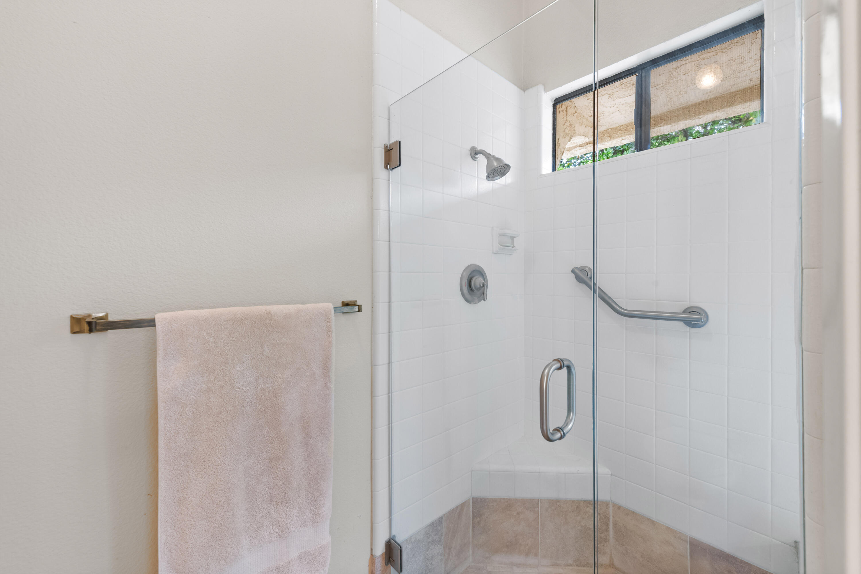 53 San Simeon Place Rancho Mirage, CA 92270 - Photo 18 of 30 a bathroom with a glass shower door