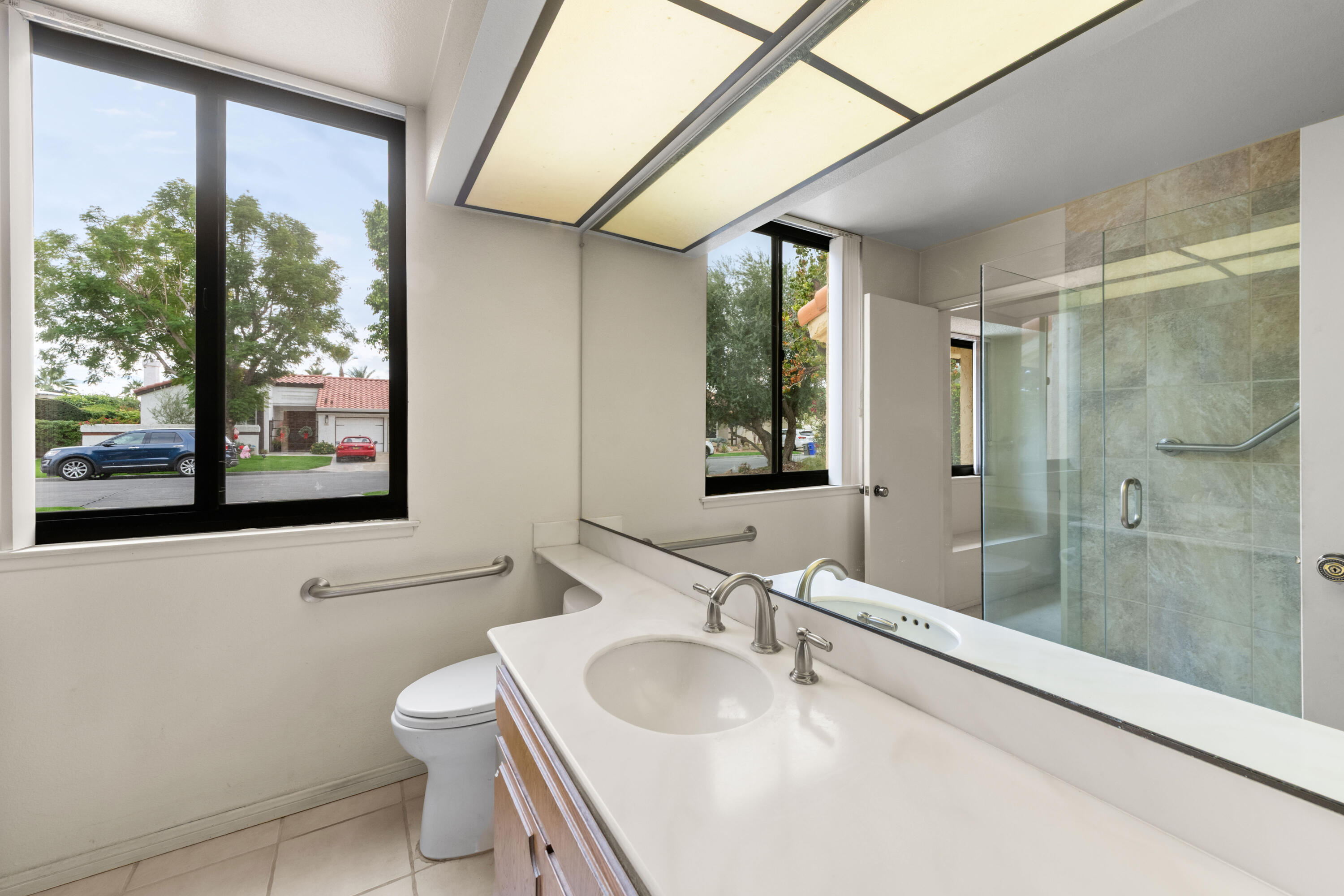 53 San Simeon Place Rancho Mirage, CA 92270 - Photo 21 of 30 a bathroom with a sink toilet and shower