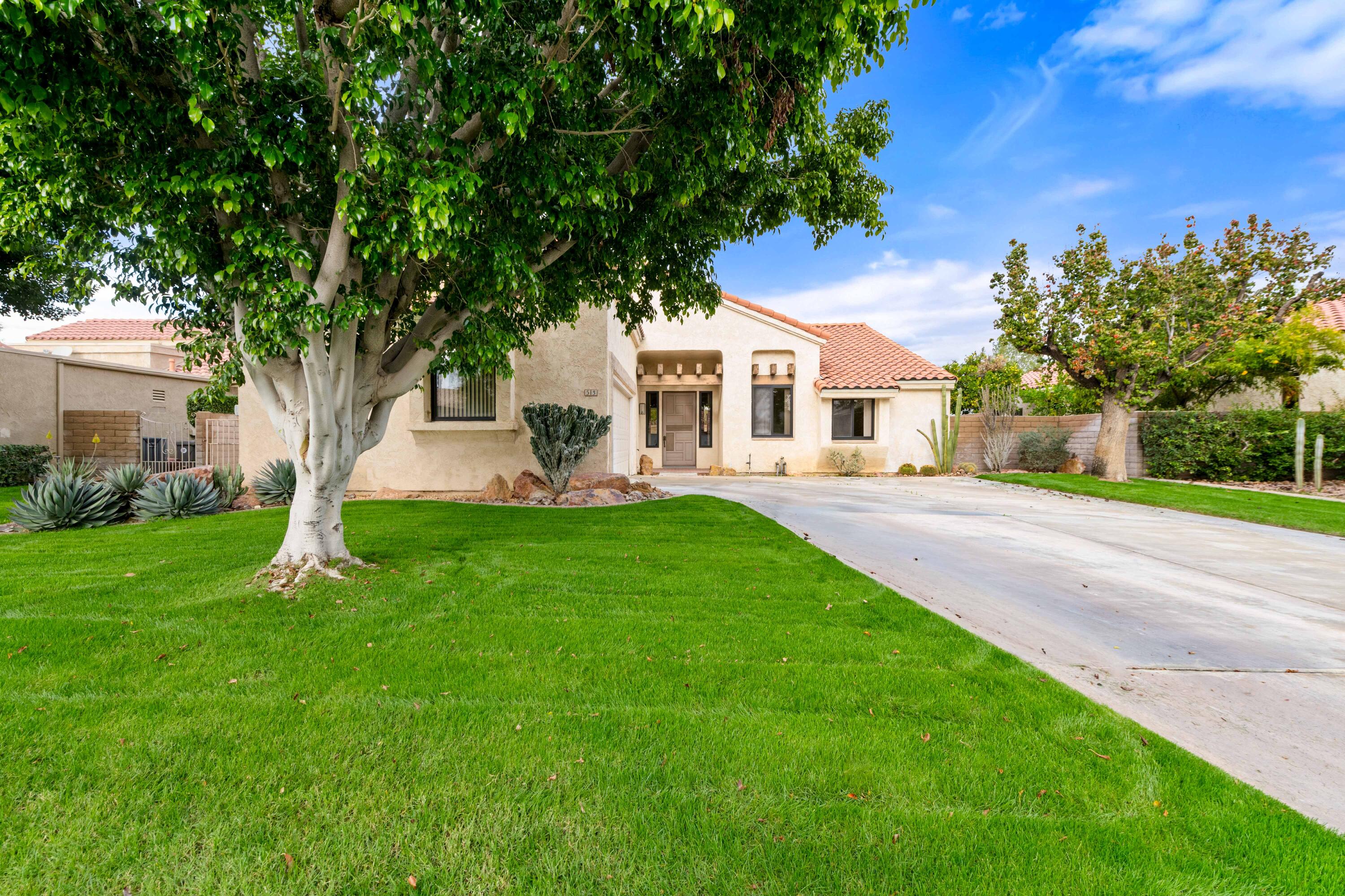 53 San Simeon Place Rancho Mirage, CA 92270 - Photo 27 of 30 a front view of a house with a yard