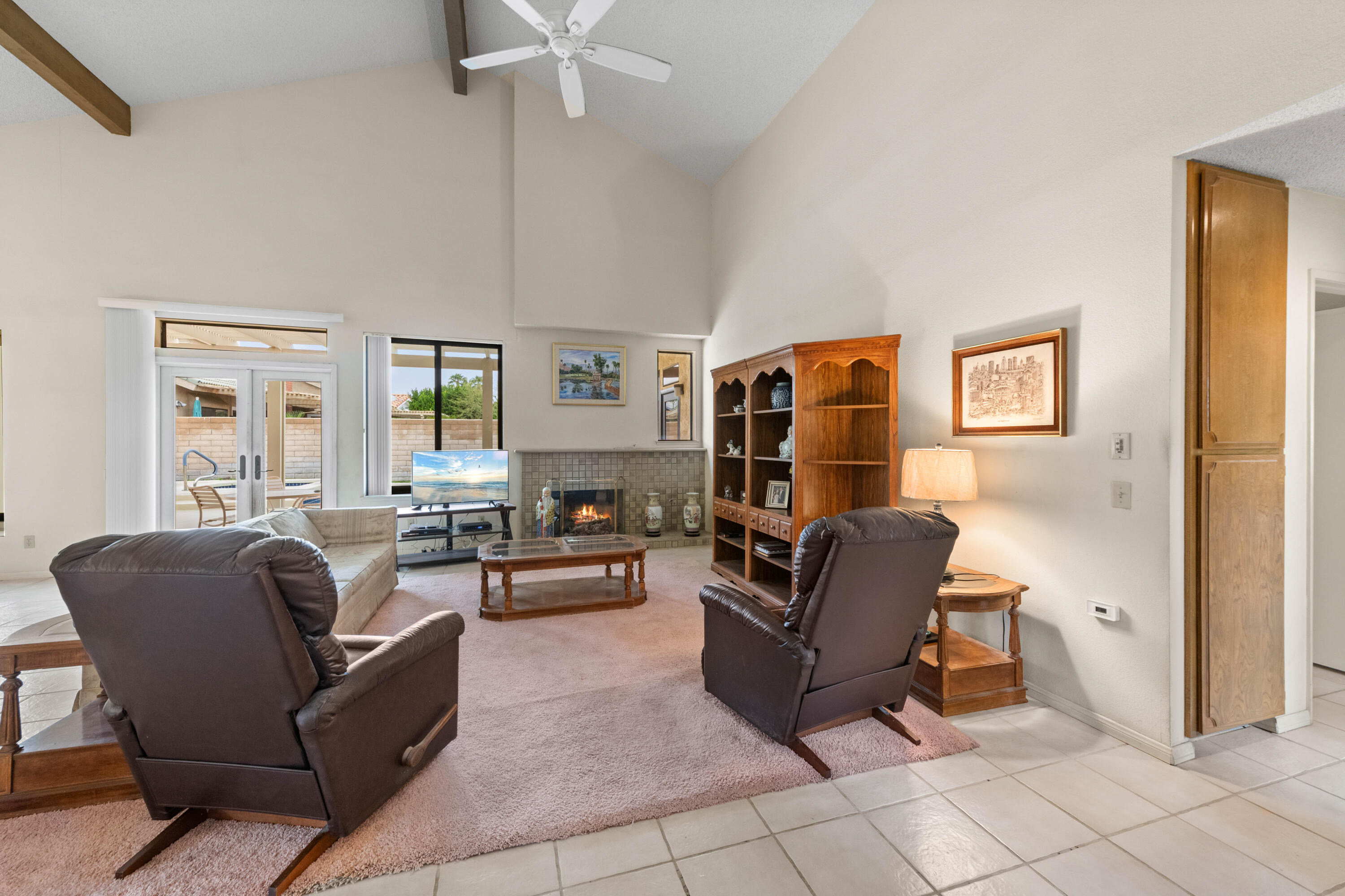 53 San Simeon Place Rancho Mirage, CA 92270 - Photo 4 of 30 a living room with furniture and a window