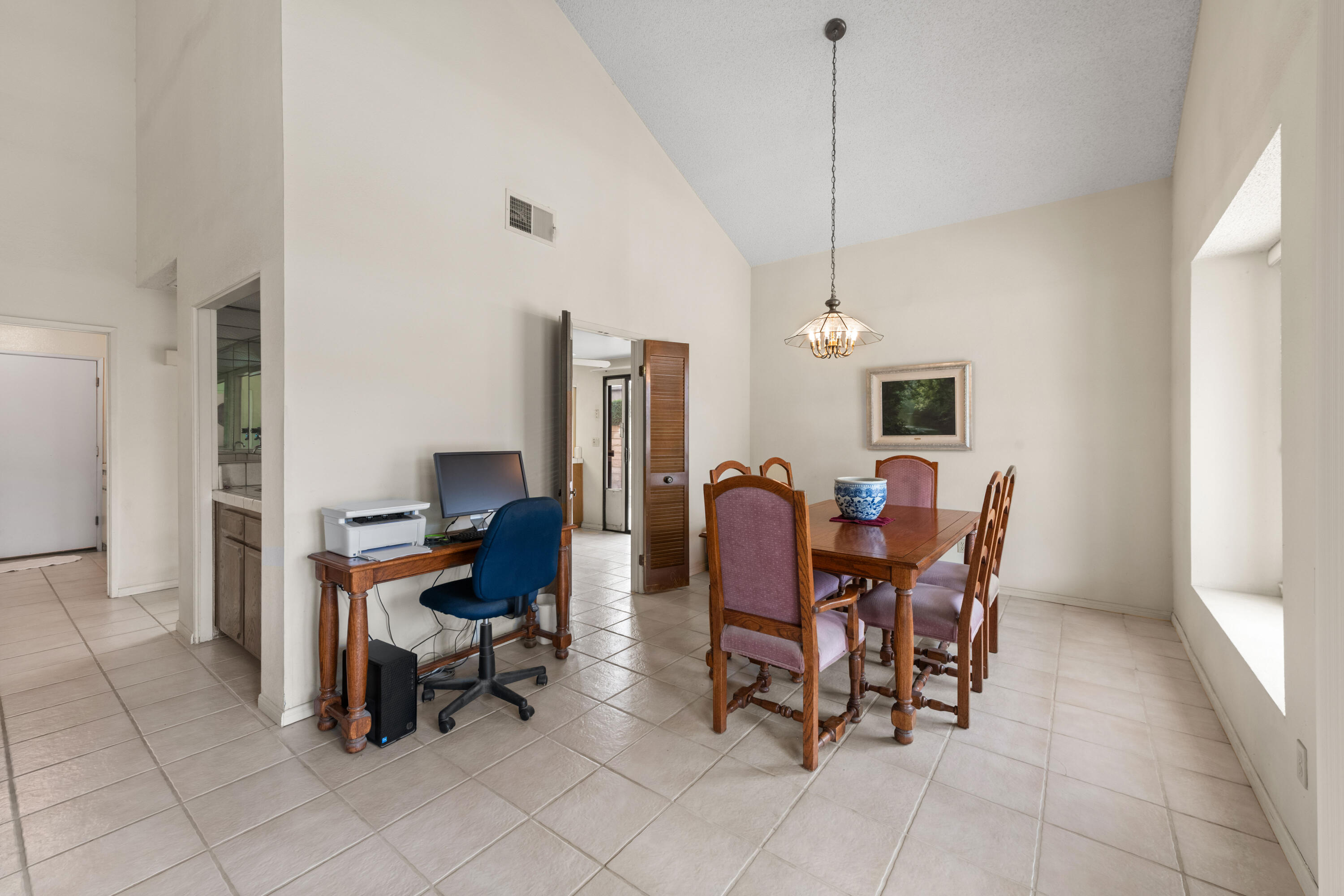 53 San Simeon Place Rancho Mirage, CA 92270 - Photo 6 of 30 a view of a dining room with furniture