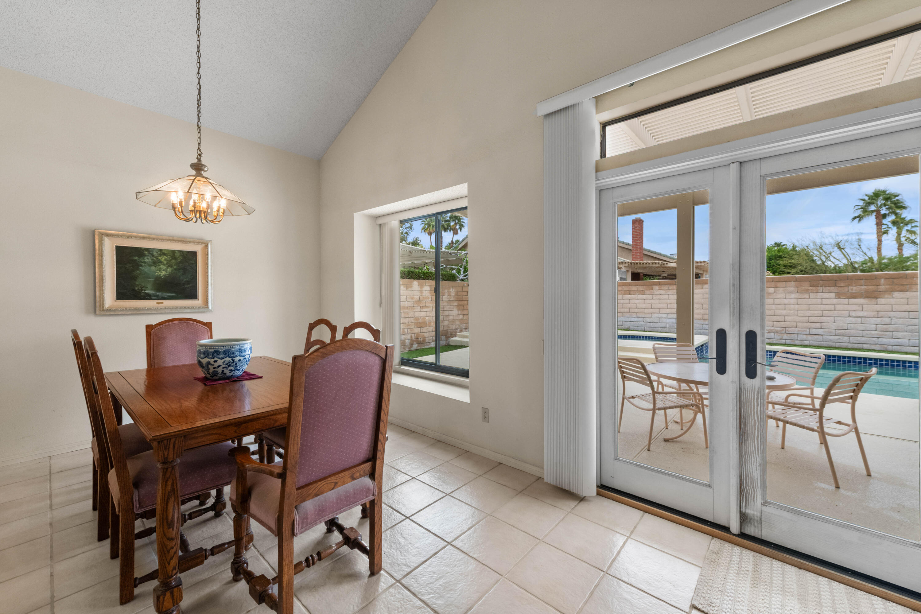 53 San Simeon Place Rancho Mirage, CA 92270 - Photo 7 of 30 a dining room with furniture and window